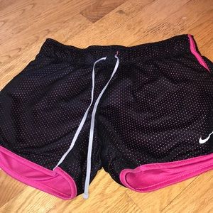 Black and pink athletic Nike shorts